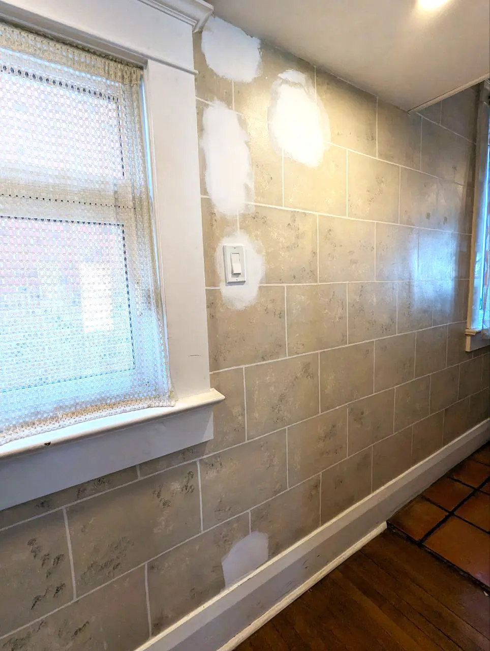 Venetian plaster wall repair and interior painting in Leaside hallway after electrical work, with holes filled, sanded, and primed before painting.