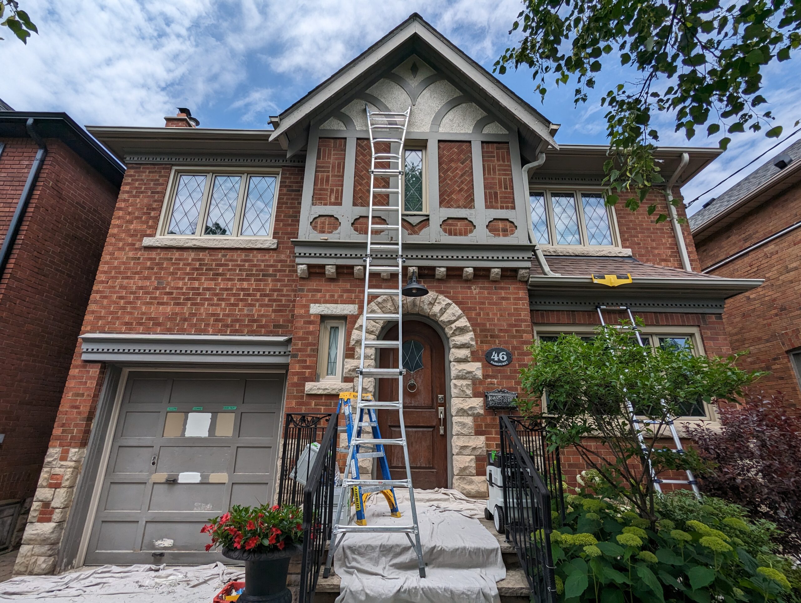 painting wood window frames in Leaside to match the color of new windows.