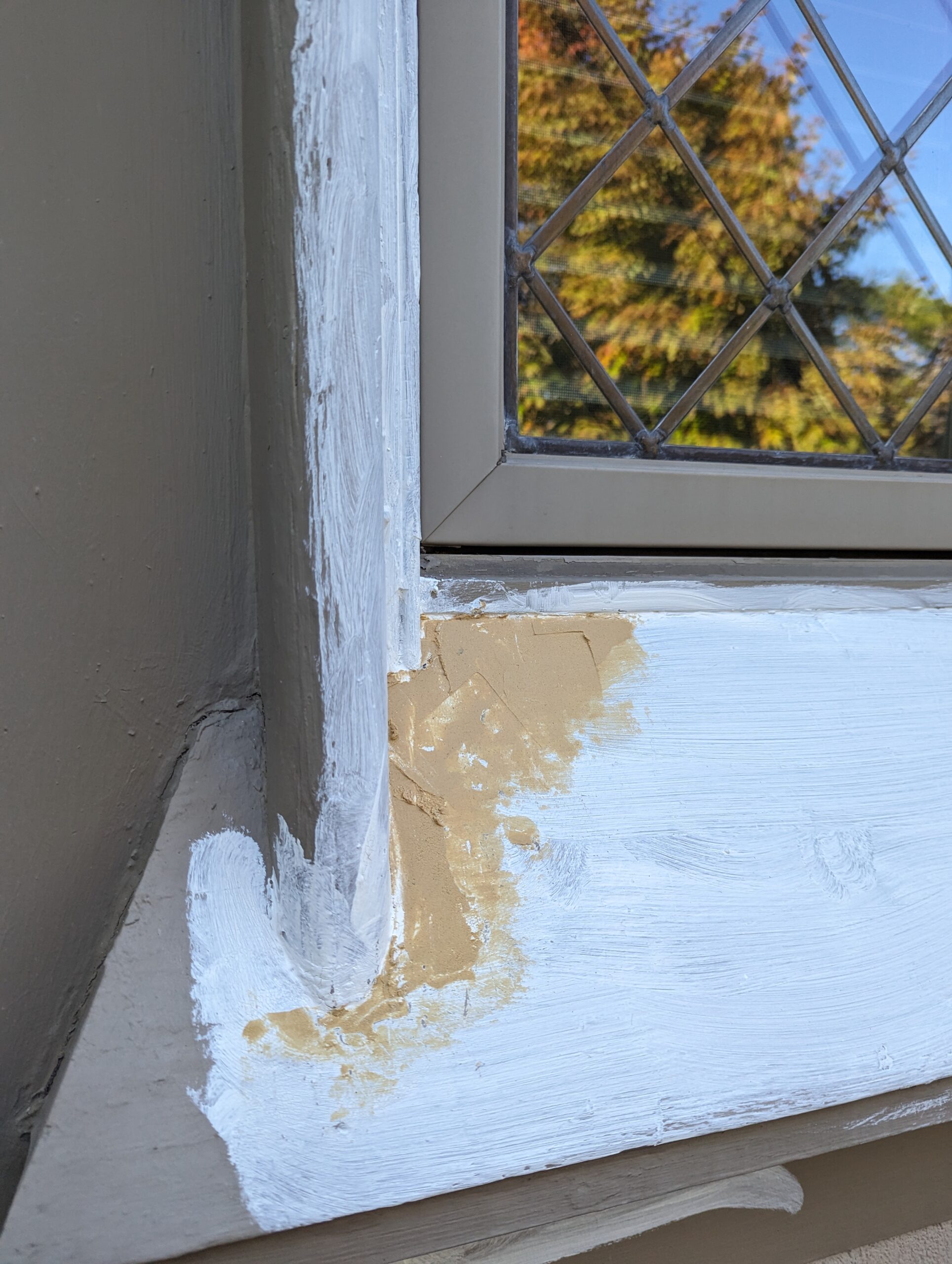 During Painting window frames exterior-scrapping sanding, caulking, priming, painting in Leaside, Toronto