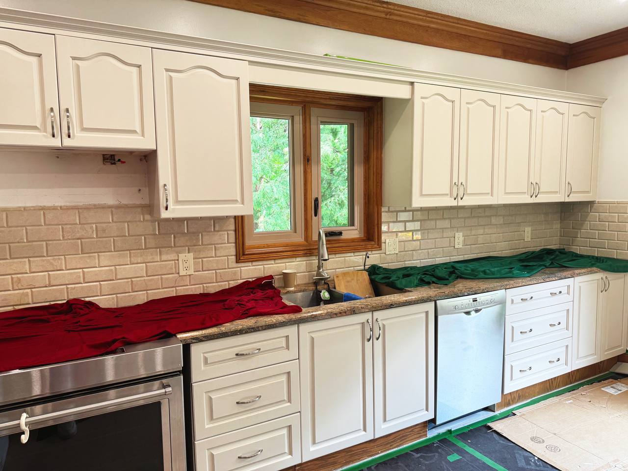 Kitchen Cabinet Painting Project in Orangevi;; - Cedar Key an off-white cabinet paint color with gray undertones.