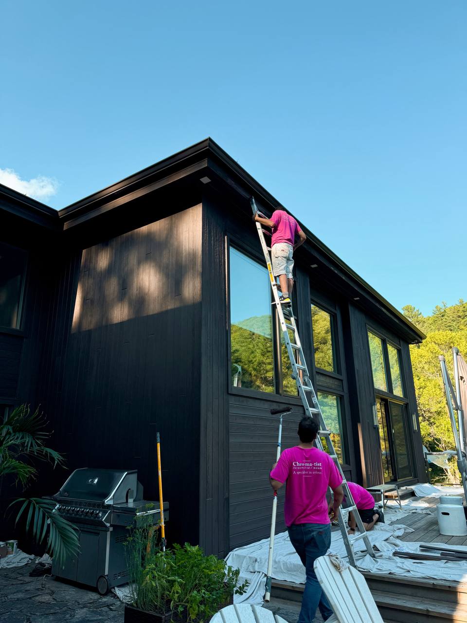 Freshly painted exterior wood siding on a home in Kawartha Lake, showcasing a smooth, vibrant finish that enhances the natural beauty of the wood