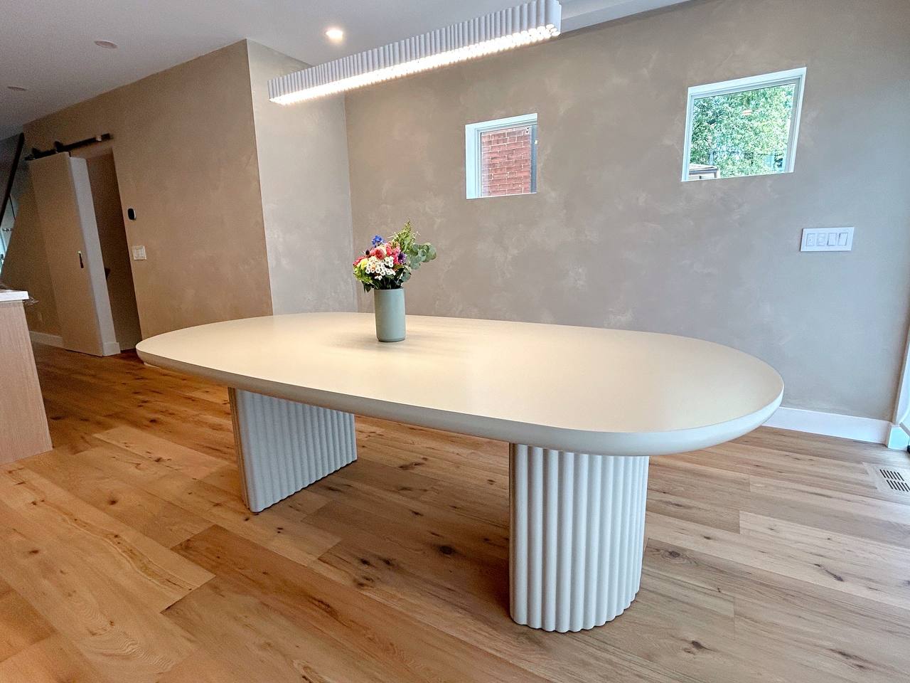 Limewash accent wall in a dining room where limewash paint is tinted Benjamin Moore color Nimbus, showcasing a soft, textured finish in a Toronto living room