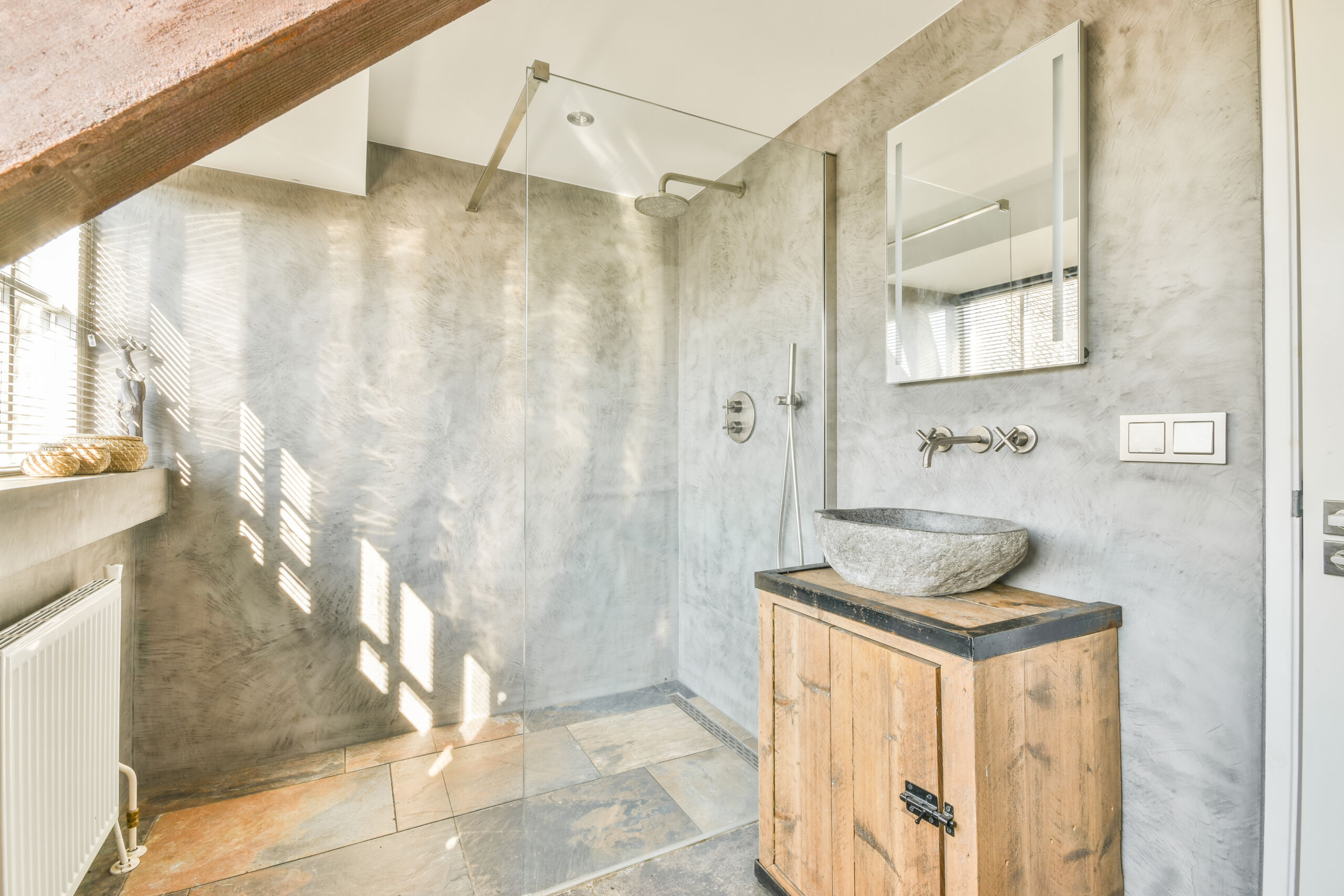 Modern bathroom in York, Toronto, featuring a microcement shower creating a sleek and cohesive look.