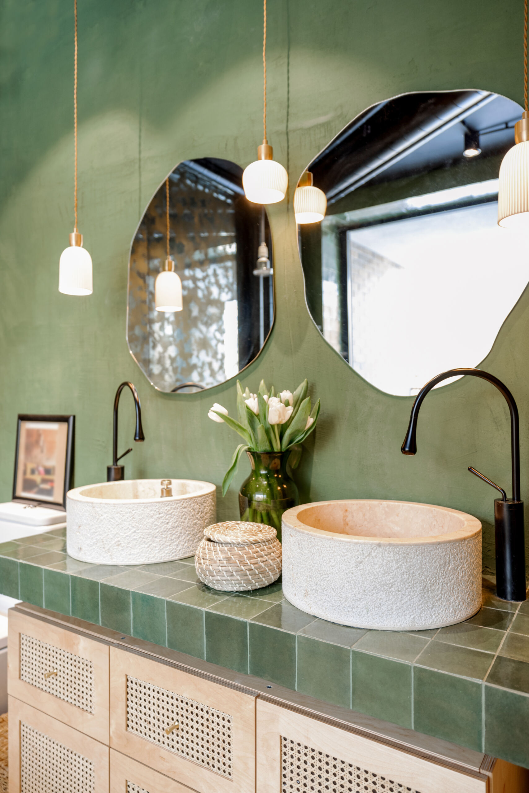 Plaster wall in the bathroom of a Toronto house in a boho green colour