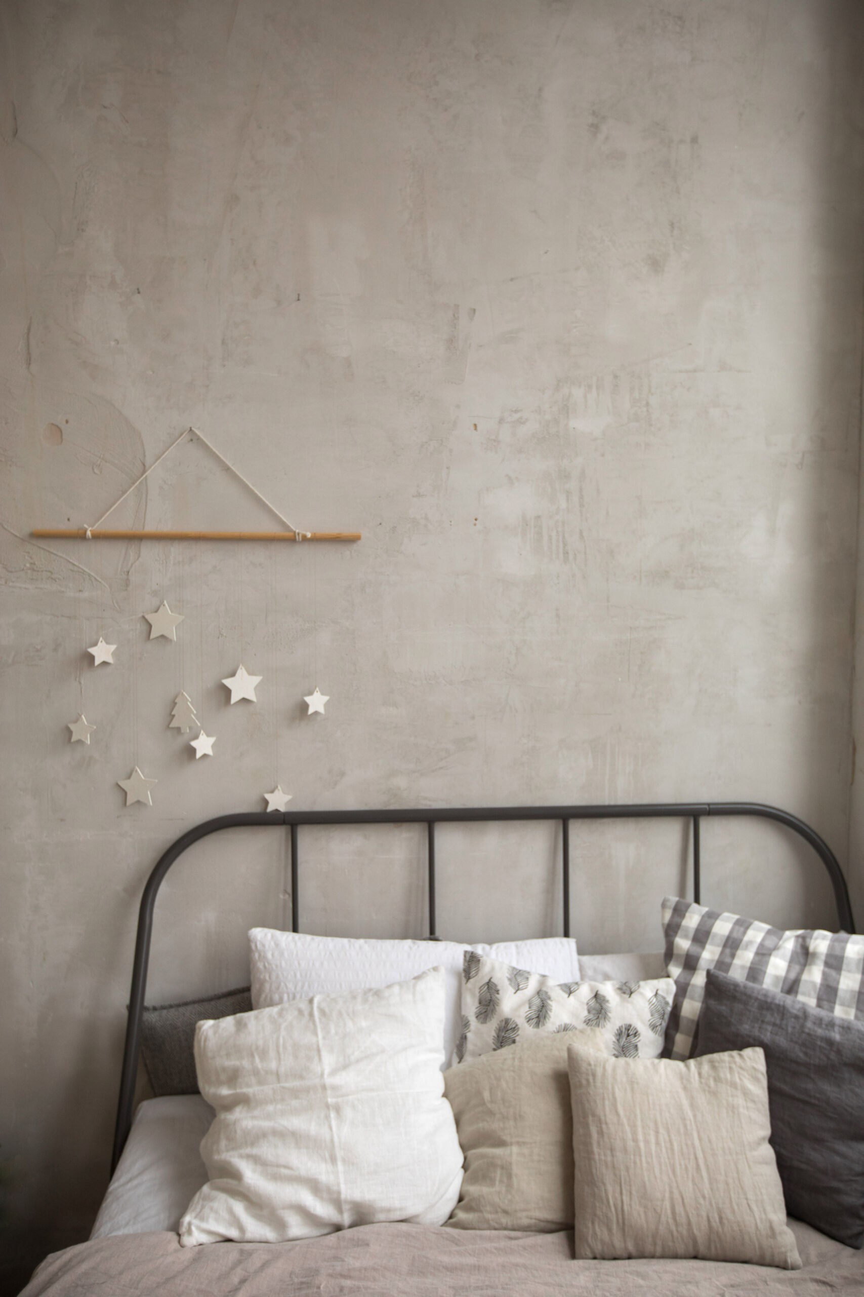 Greige-colored microcement textured wall in a kid's bedroom.