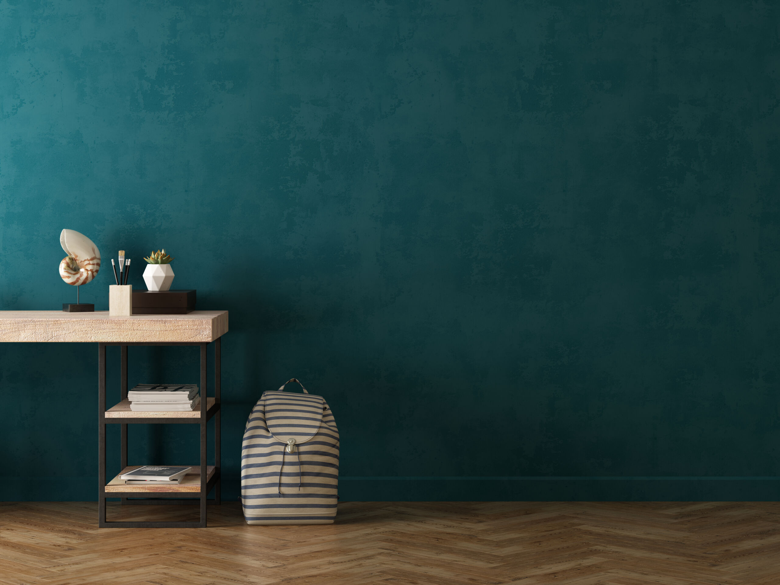 A study room interior wall finished in green limewash paint, adding a calm and textured backdrop to the space.