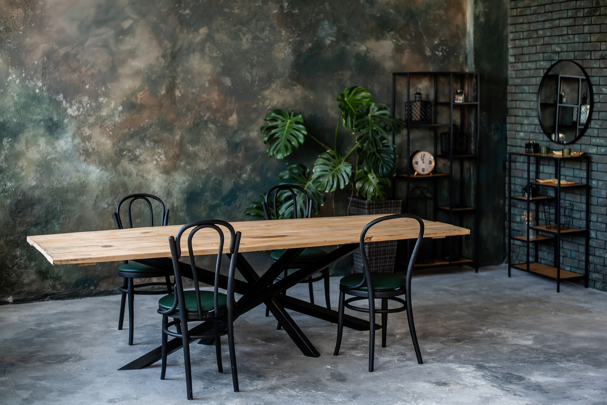 Stylish café interior with grey, green, and gold Venetian plaster walls