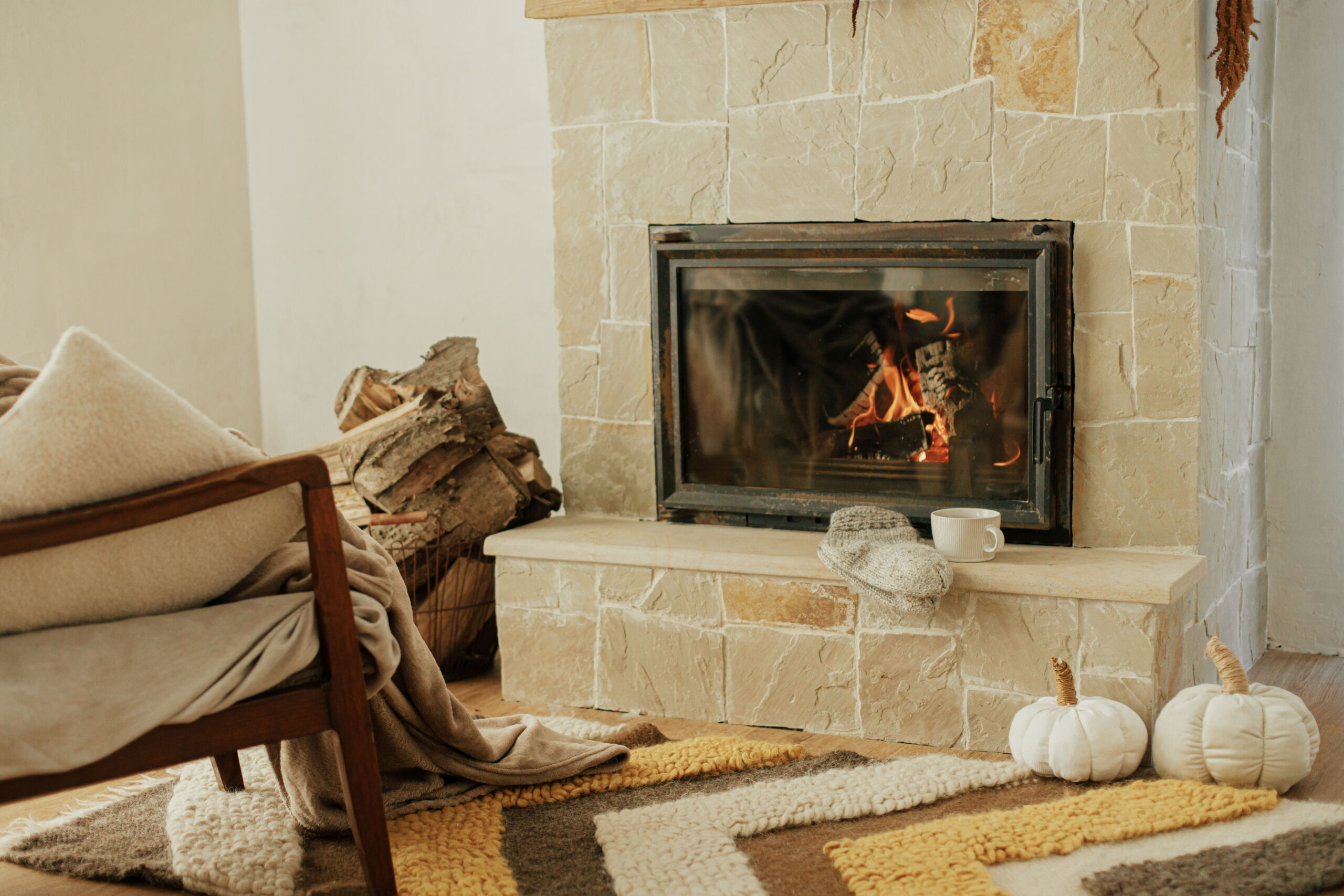 Fireplace masonry whitewashed in limewash, featuring a soft, rustic finish in a cozy living room.