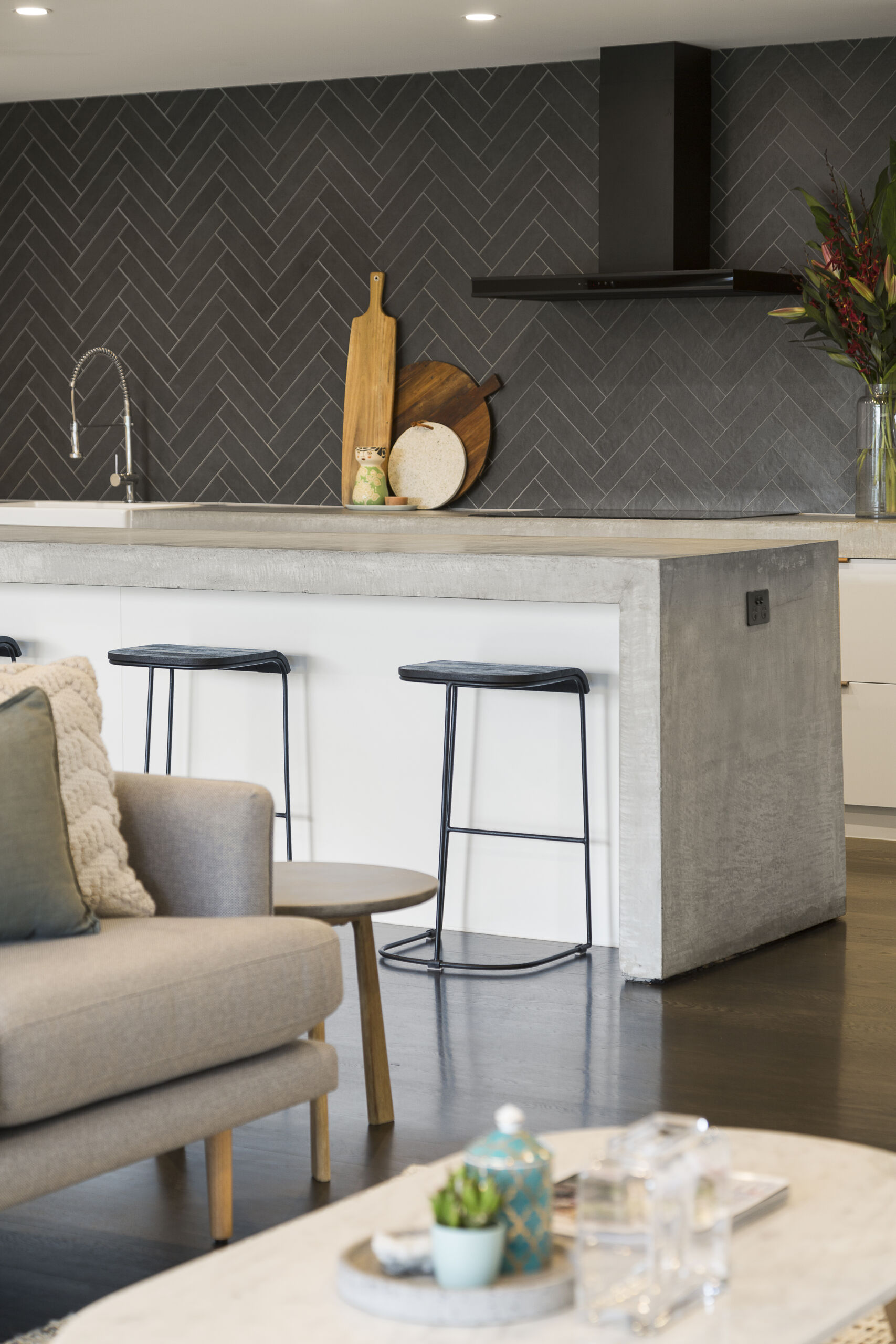 Microcement kitchen island in beige-grey finish, adding a sleek and modern touch to the kitchen interior design.