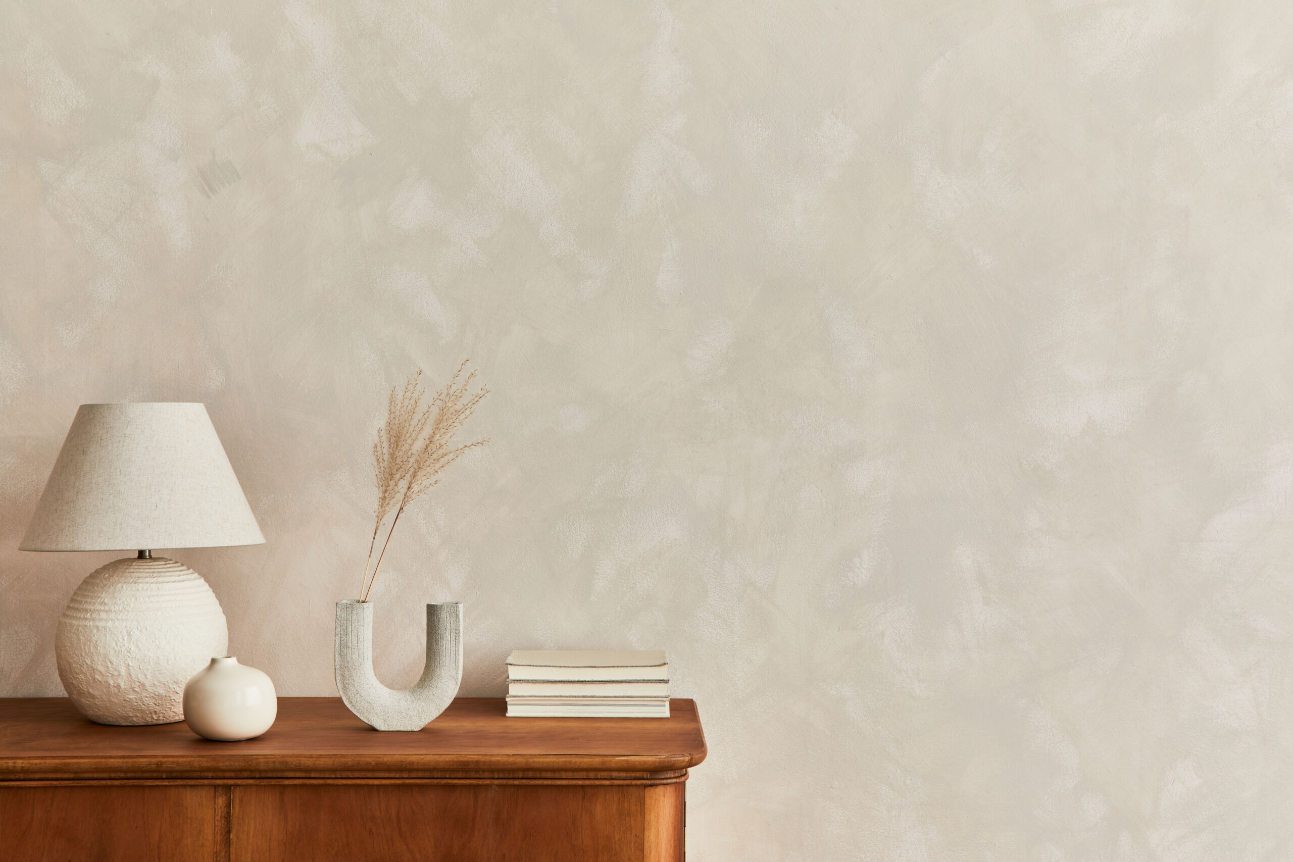 Cozy boho condo bedroom with textured limewash wall.