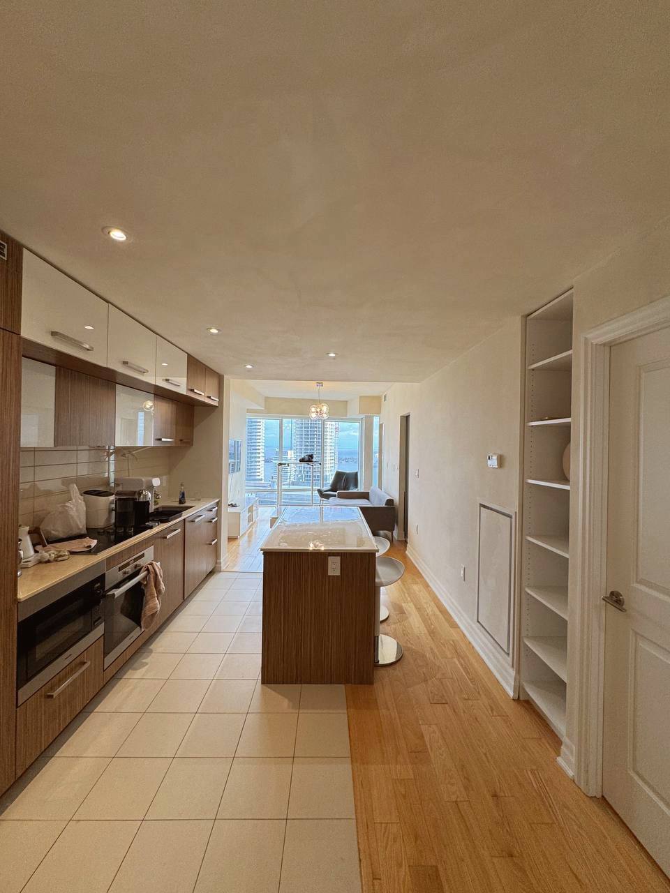 Toronto apartment makeover featuring light greige limewash finish on walls, ceilings, and baseboards.