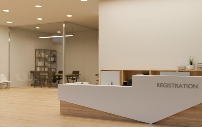 Modern office reception desk and entrance in a soft beige microcement finish and millwork